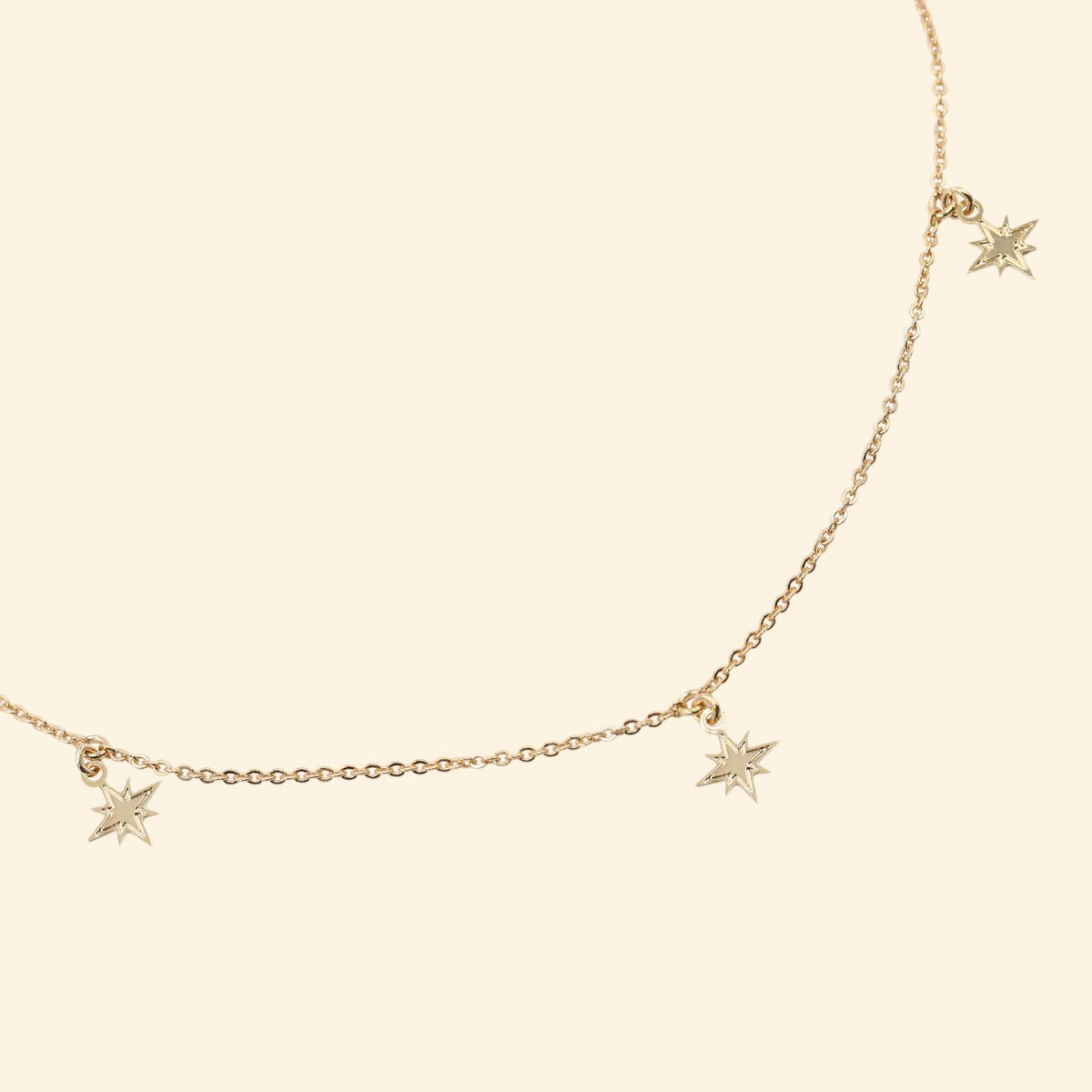 collier doré ajustable 3 papilles étoiles